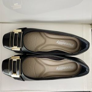 Piccadilly Cloud black flats with gold buckle